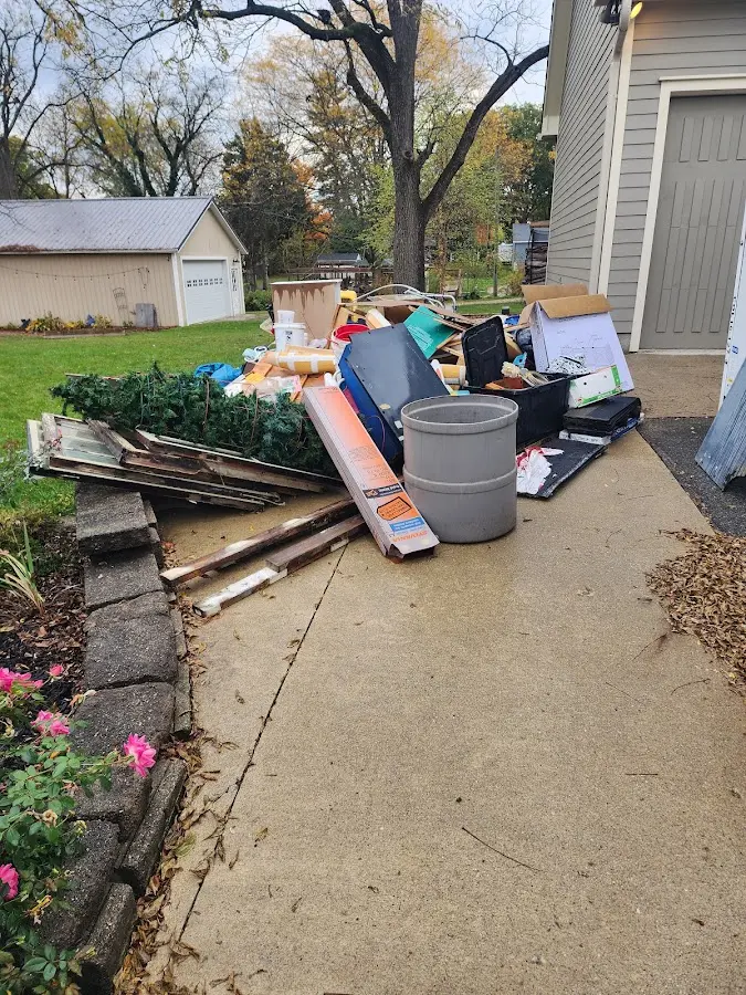 Dumpster being loaded with debris for Residential Dumpster Rental in South Holland